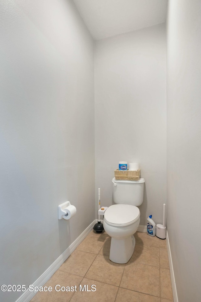 bathroom with tile patterned floors and toilet