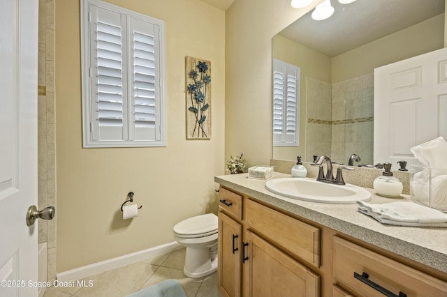 bathroom with vanity, tile patterned floors, and toilet