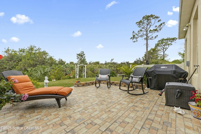 view of patio featuring a grill