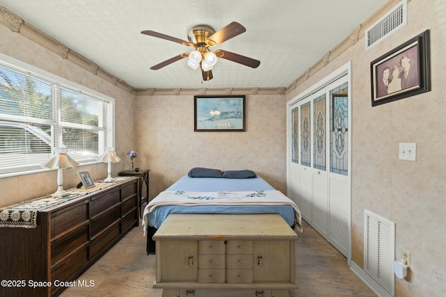 bedroom with hardwood / wood-style floors and ceiling fan