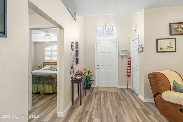 entrance foyer with a chandelier and hardwood / wood-style floors