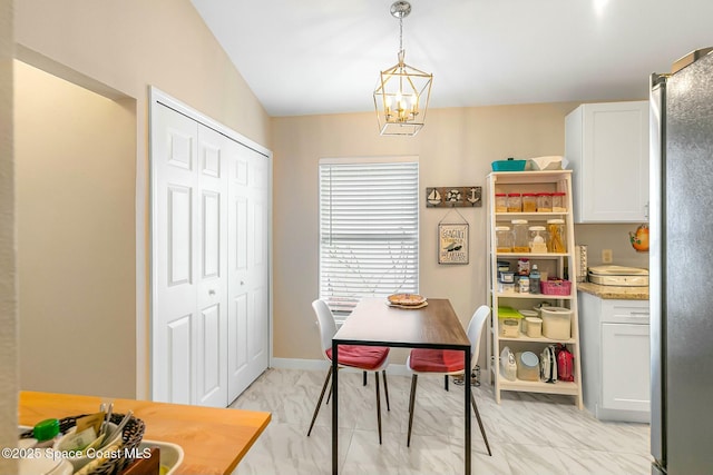 dining area featuring an inviting chandelier