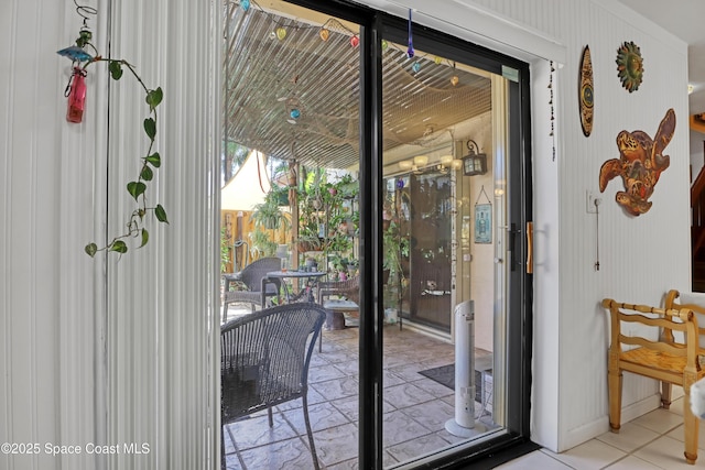 doorway featuring light tile patterned floors