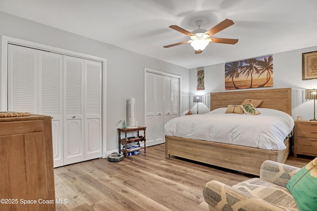 bedroom with multiple closets, ceiling fan, and light wood-type flooring