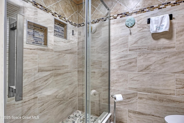 bathroom featuring an enclosed shower