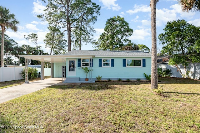 single story home with a front yard and a carport