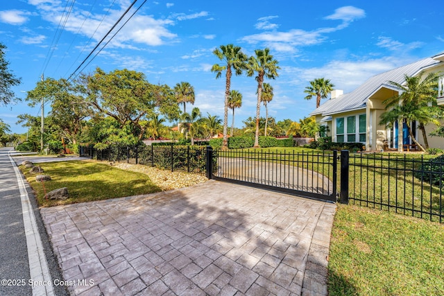 view of gate featuring a lawn