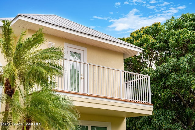 view of side of property featuring a balcony