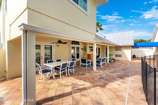 view of patio / terrace featuring french doors and ceiling fan