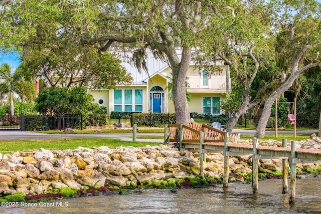 view of front of property featuring a water view