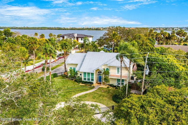 birds eye view of property featuring a water view