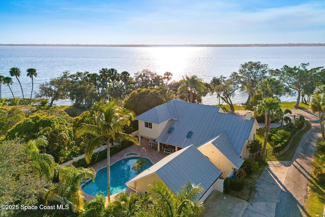 birds eye view of property with a water view