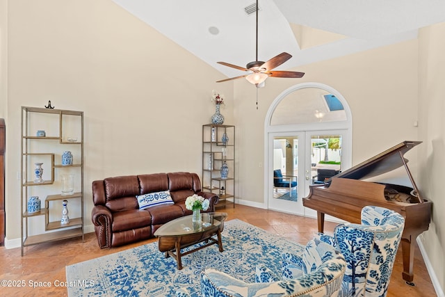 living room with light tile patterned floors, high vaulted ceiling, french doors, and ceiling fan