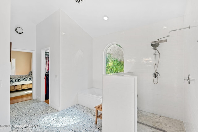 bathroom with plus walk in shower and lofted ceiling