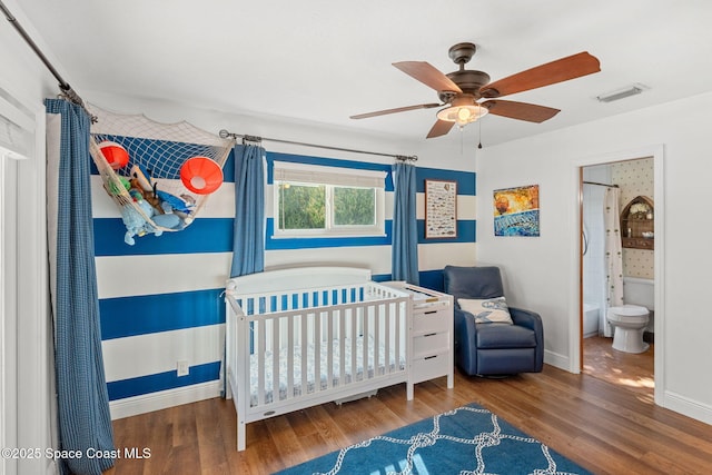 bedroom with ceiling fan and wood-type flooring