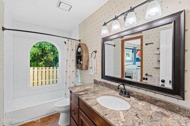 full bathroom featuring vanity, toilet, and shower / bath combo