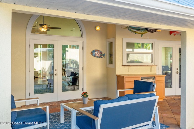 exterior space featuring french doors, ceiling fan, and tile patterned flooring