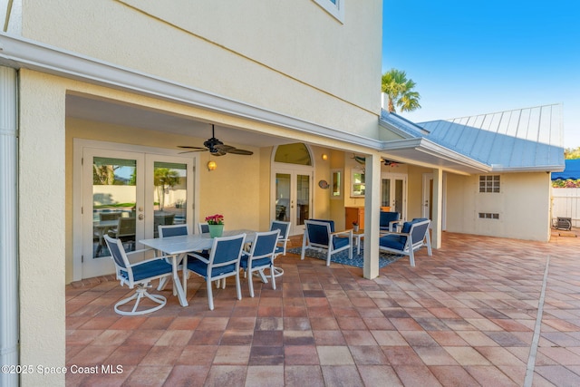 view of patio featuring french doors and ceiling fan