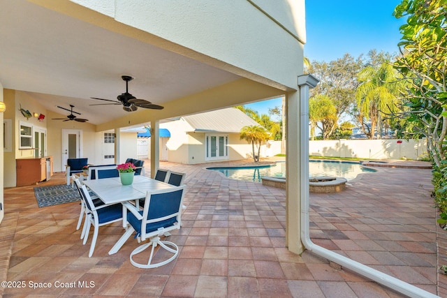 view of patio featuring a fenced in pool and ceiling fan