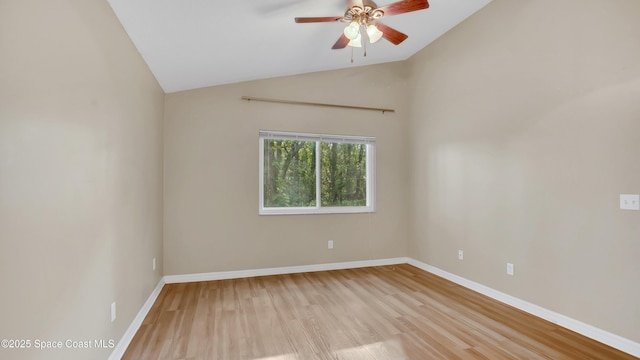 unfurnished room with vaulted ceiling, ceiling fan, and light hardwood / wood-style floors