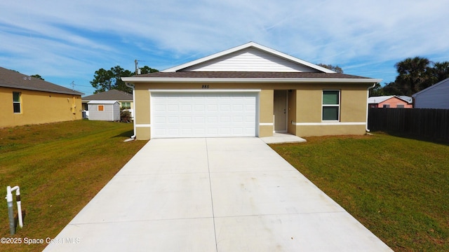 single story home with a garage and a front yard