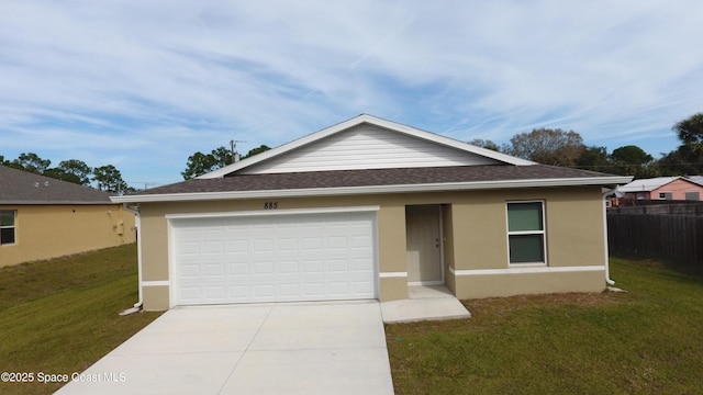 single story home featuring a garage and a front lawn