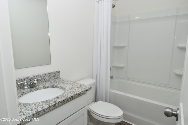 full bathroom with shower / bath combination with curtain, vanity, and toilet