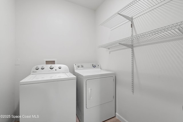 laundry room with independent washer and dryer