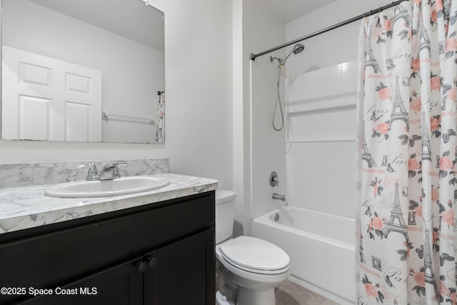 full bathroom with vanity, shower / tub combo, and toilet