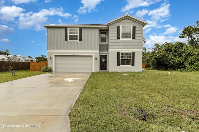 view of front property with a garage and a front yard