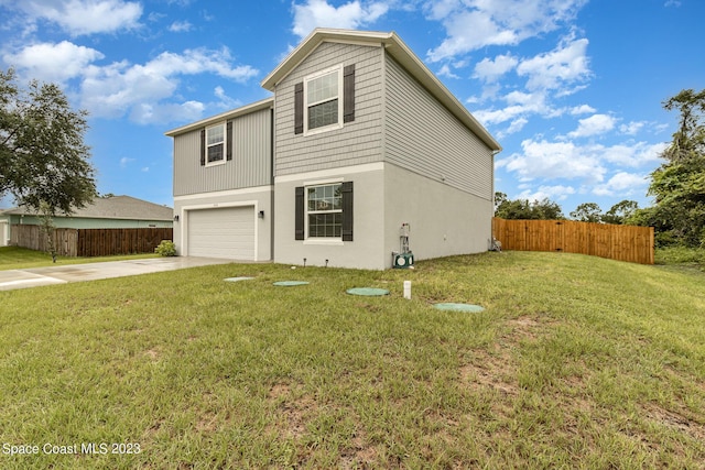 front of property featuring a garage and a front yard