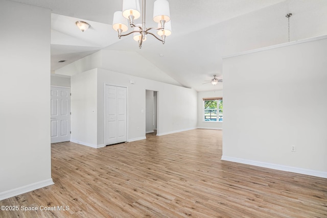 unfurnished living room featuring light wood-type flooring, ceiling fan with notable chandelier, baseboards, and lofted ceiling