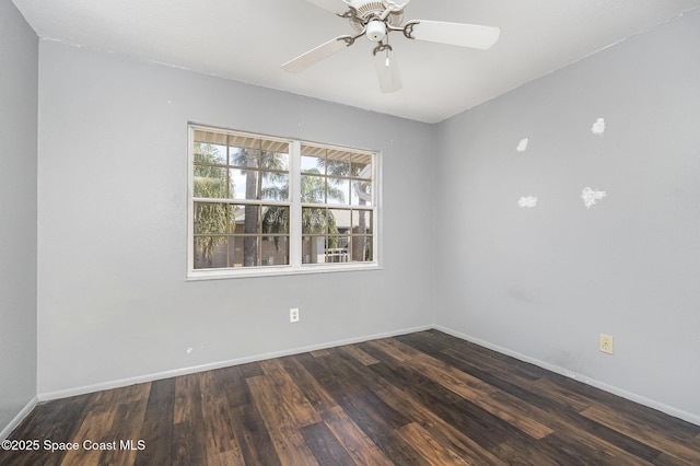 spare room featuring ceiling fan and dark hardwood / wood-style floors