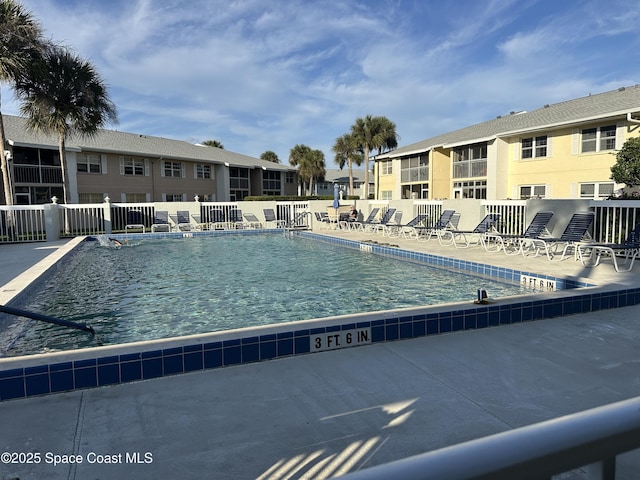 view of swimming pool with a patio