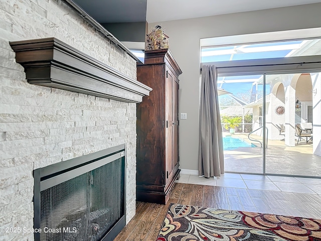 interior space featuring wood-type flooring and a fireplace