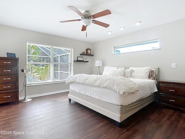 bedroom featuring dark hardwood / wood-style flooring and ceiling fan