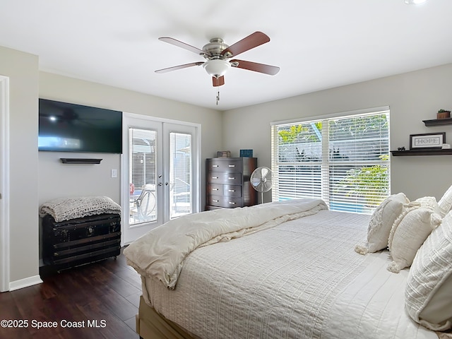 bedroom with multiple windows, dark hardwood / wood-style flooring, access to exterior, ceiling fan, and french doors