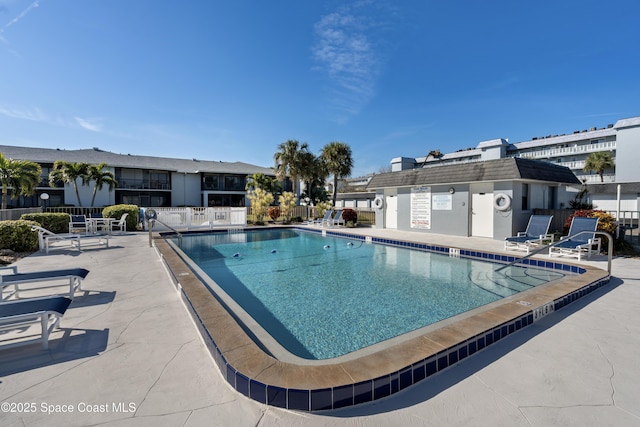 view of pool featuring a patio