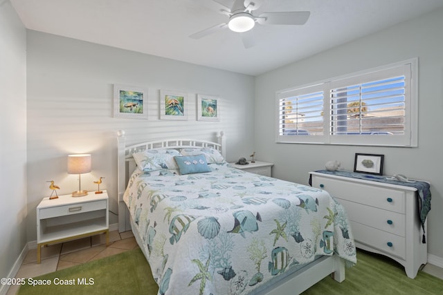 tiled bedroom with ceiling fan