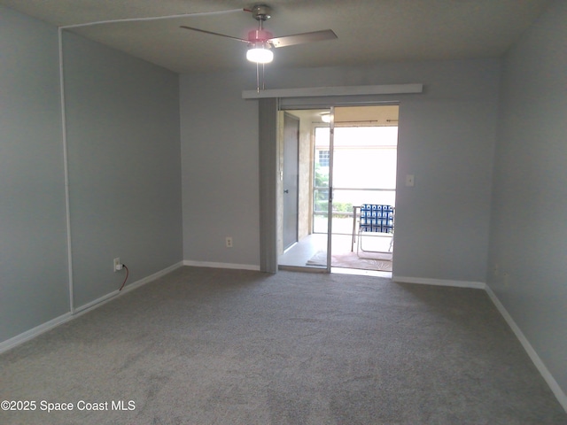 spare room featuring carpet flooring and ceiling fan