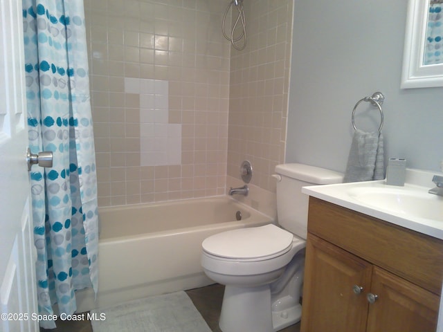 full bathroom featuring vanity, shower / tub combo with curtain, and toilet