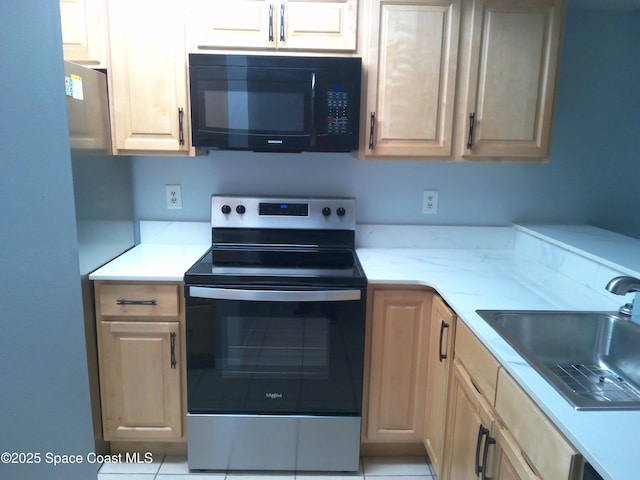 kitchen featuring sink, light tile patterned floors, stainless steel electric stove, and light brown cabinets