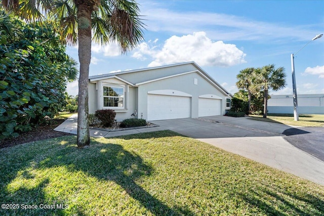 ranch-style house featuring an attached garage, a front lawn, stucco siding, and driveway