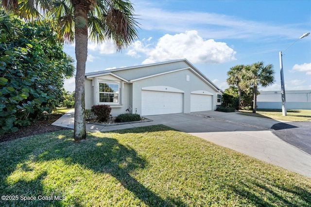 ranch-style home with a garage and a front lawn