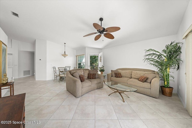 living room with light tile patterned floors and ceiling fan