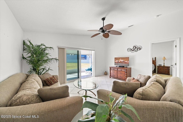 tiled living room featuring ceiling fan