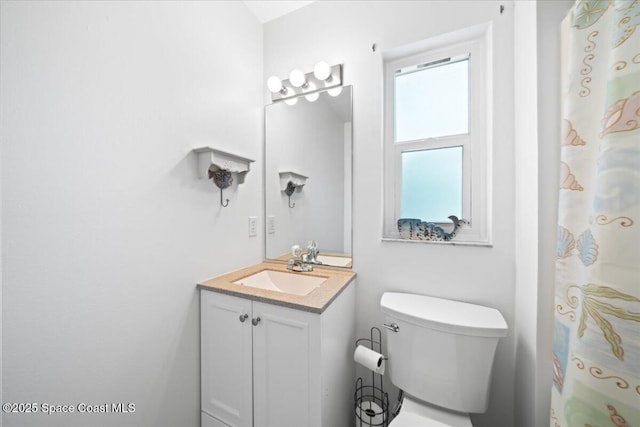 bathroom featuring vanity and toilet