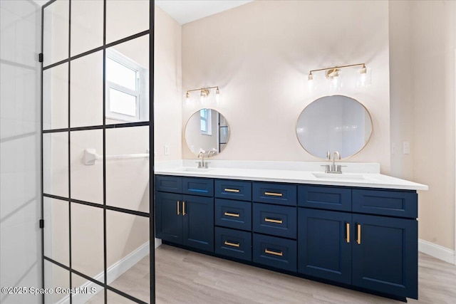 bathroom with vanity and wood-type flooring