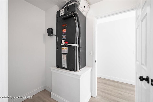 utility room featuring heating unit