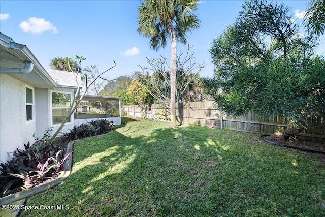 view of yard featuring a sunroom